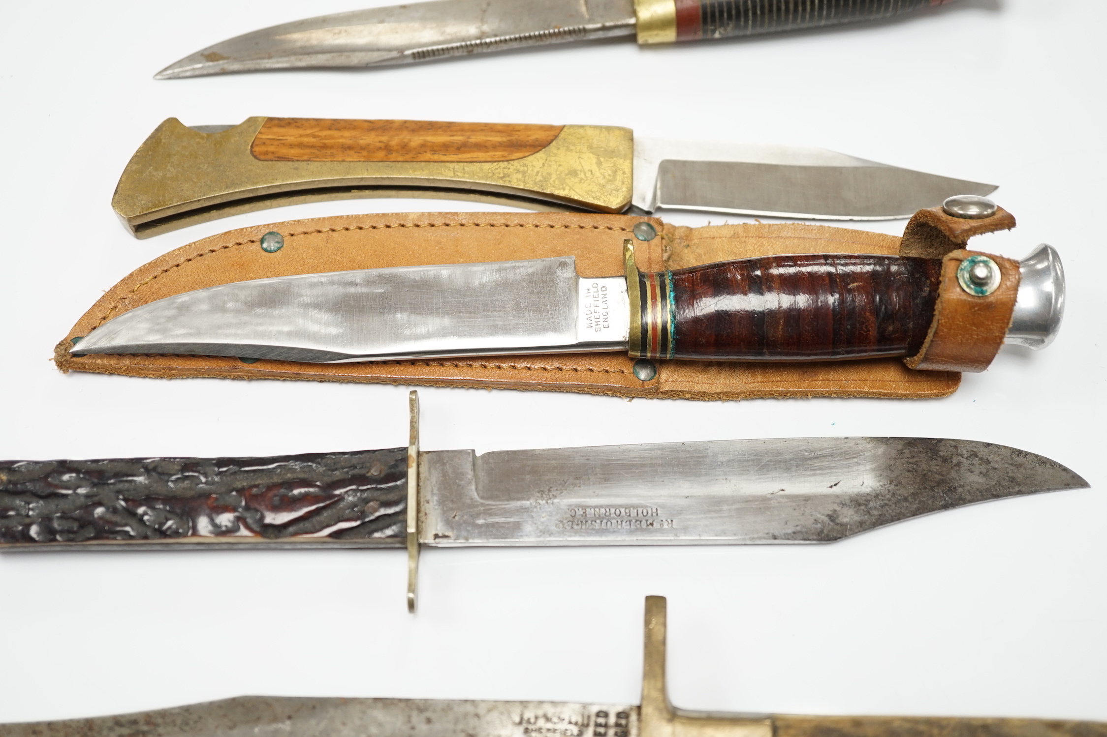 Two antler-handled hunting knives and three other knives